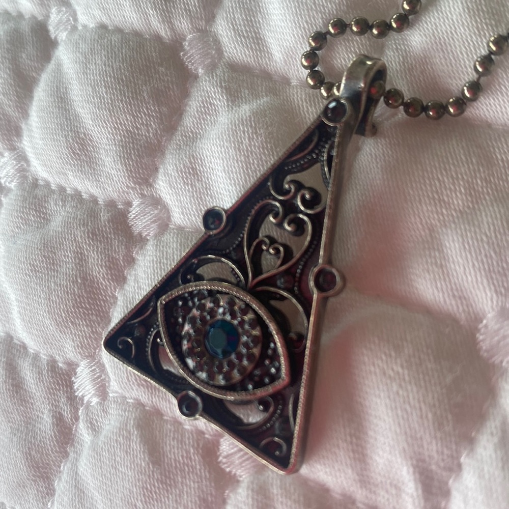 Virgins Saints & Angels evil eye pendant.